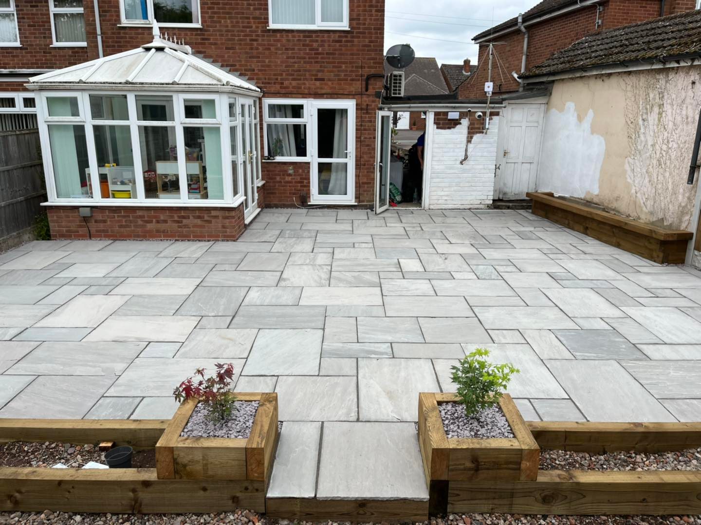 Patio with decorative stone slabs in Solihull