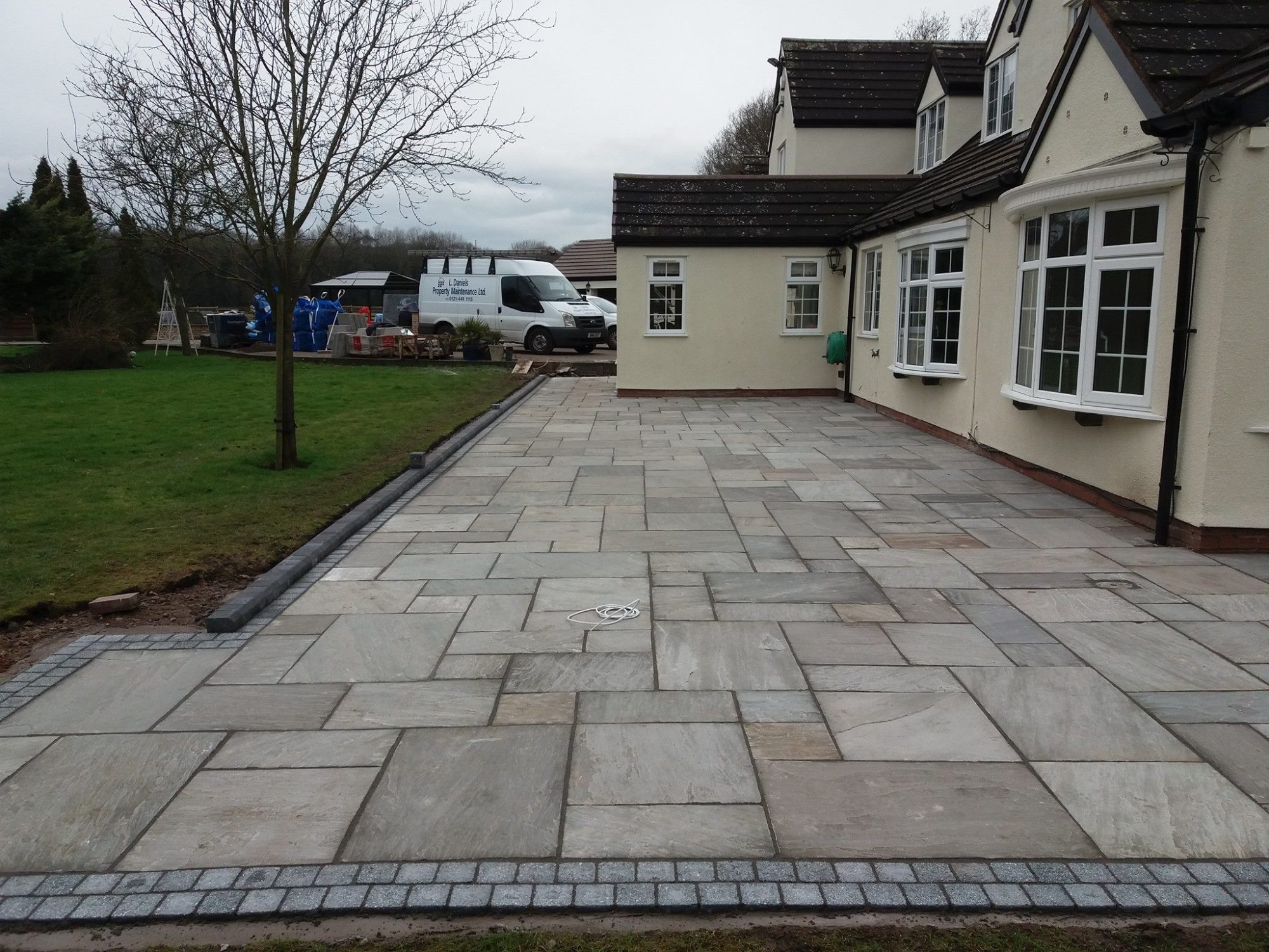 New patio installation and block paving edging installed at a large house in Birmingham