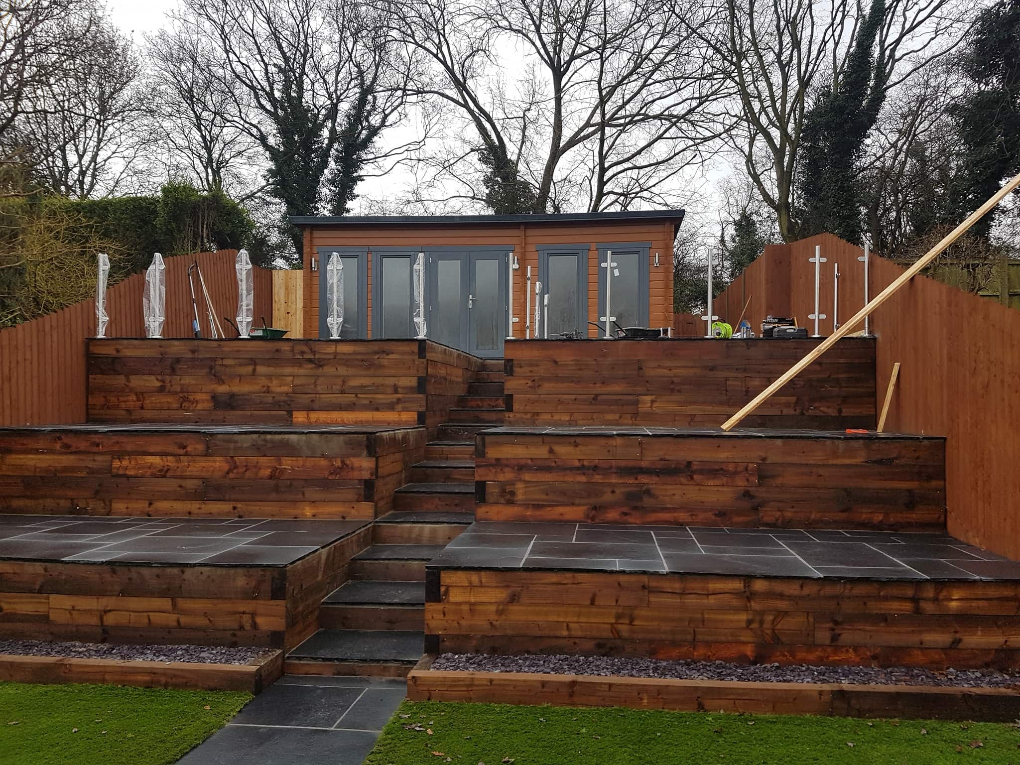 New uphill decking area fitted with timber walls and tiled areas