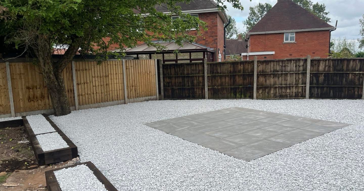 Natural stone surrounding a tile patio in Solihull
